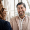 A Stena Confidential employee smiling at a colleague.