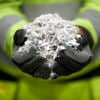 Stena Confidential employee holding shredded paper