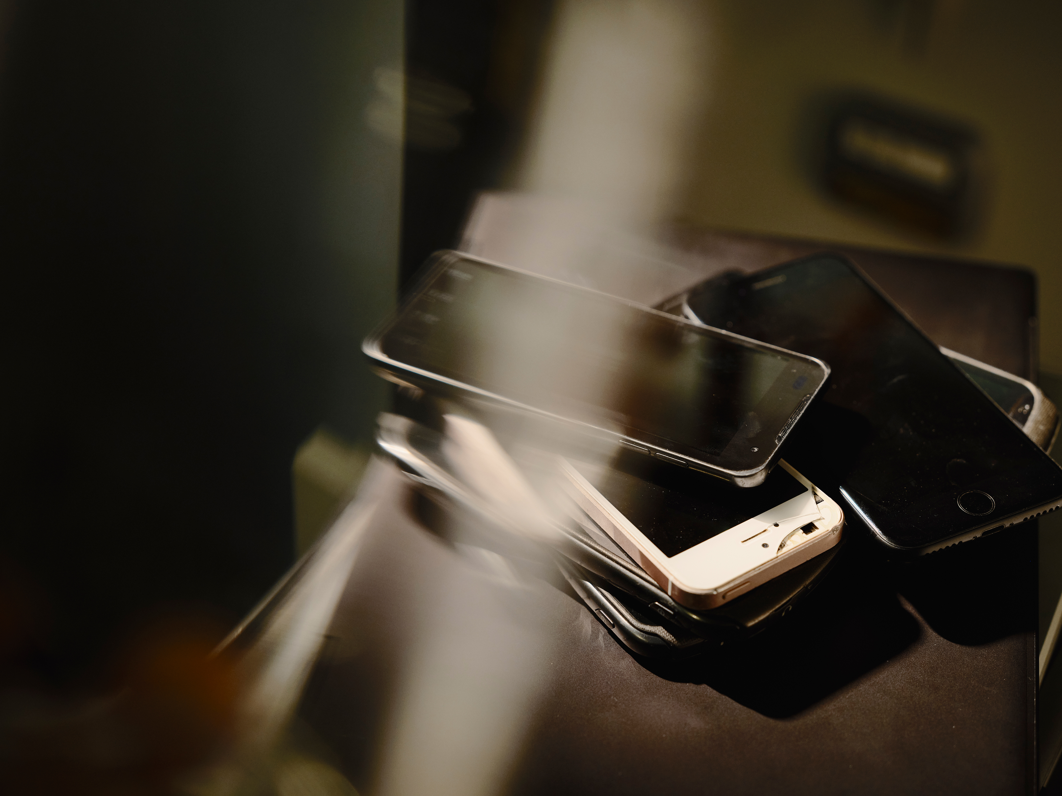 A pile of used mobile phones.